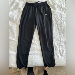 Women’s Nike Dri-Fit track pants with ankle zippers for sale!